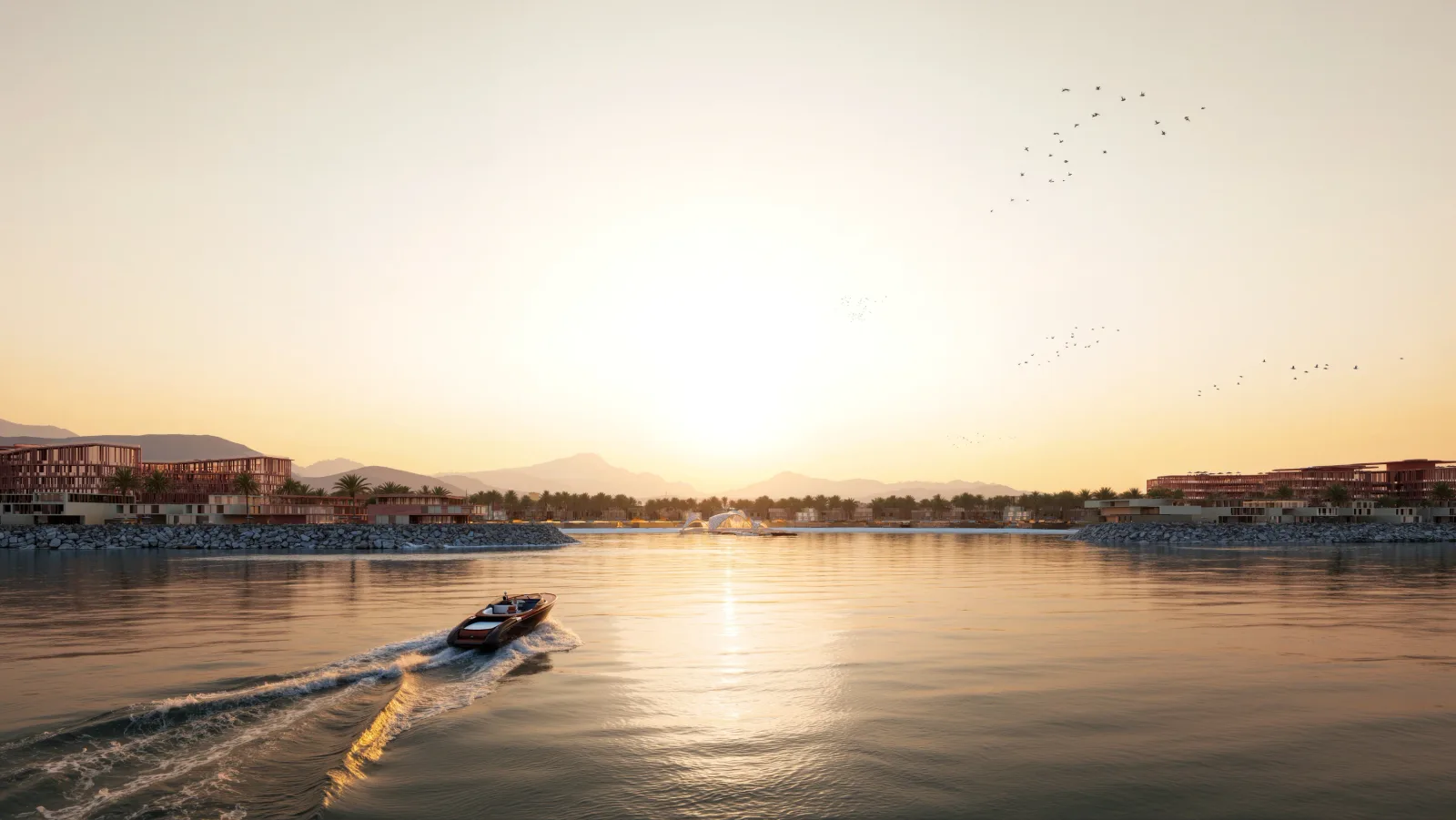 A speedboat crossing the channel at Mira Coral Bay at sunrise, the Hajar mountains behind the community