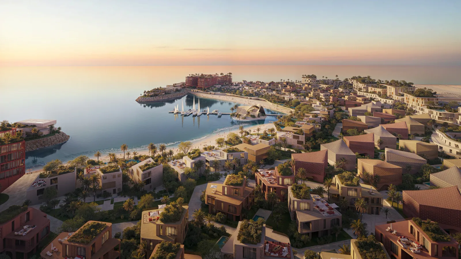 Aerial view of Mira Coral Bay at dusk, the clusters following the shoreline around the sheltered bay