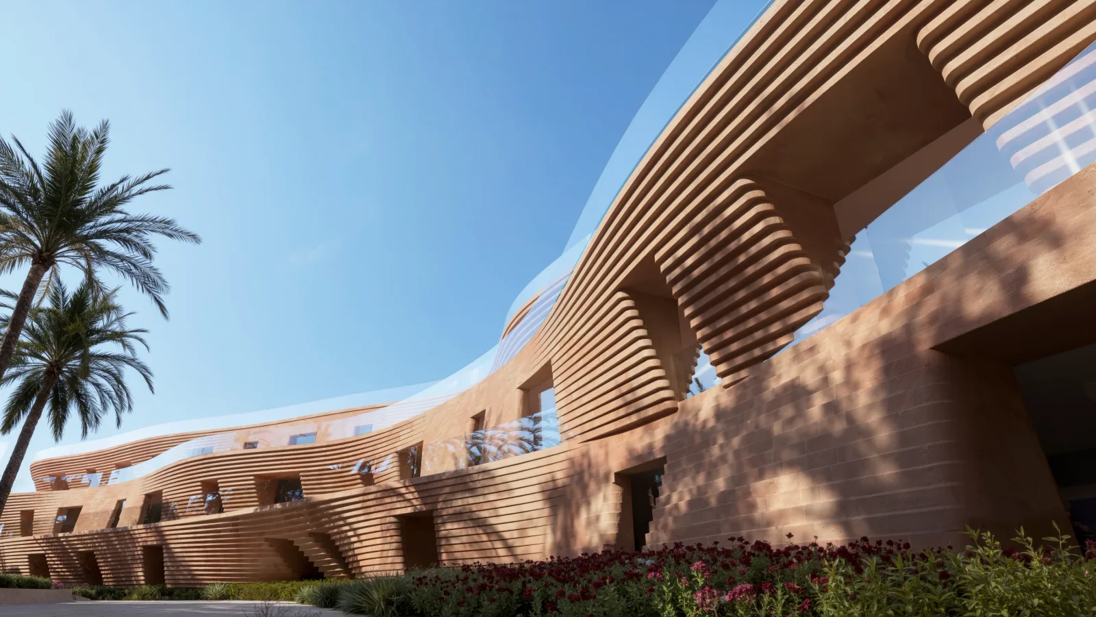 A horizontally ribbed sandstone facade curving up to its glazed roofline