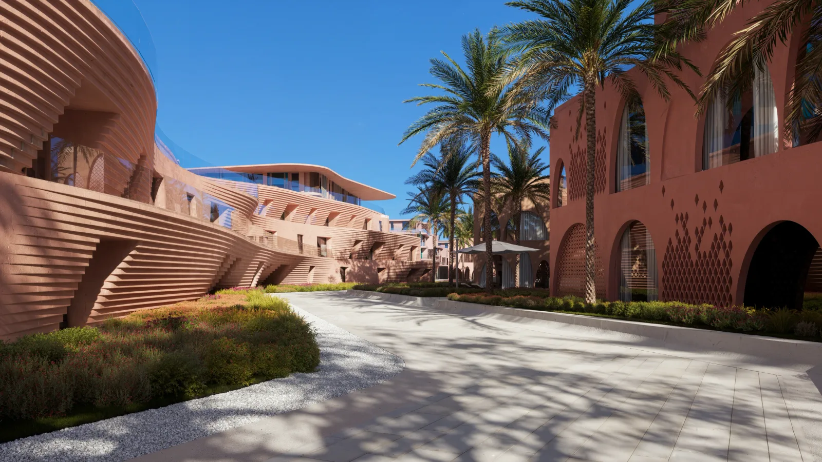 A planted walkway running between a ribbed terracotta facade and an arched residential block